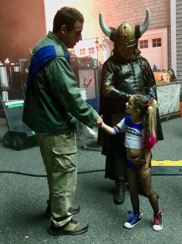 Ella Grace Helton, 6, shakes hands with Adam Sandler on set of "Hubie Halloween."