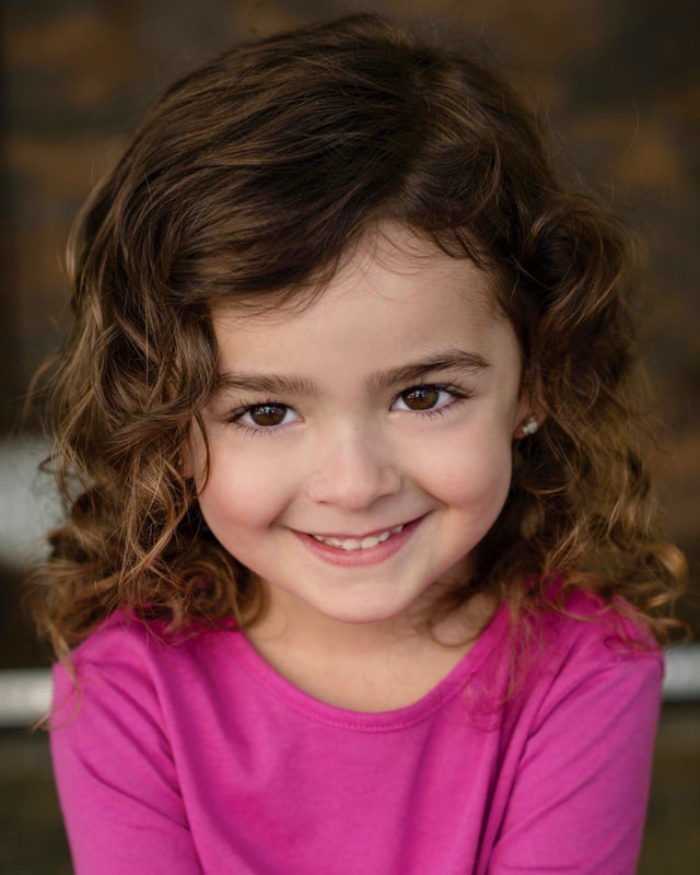 Ella Grace Helton smiles in an early headshot, taken when she was 4 years old.